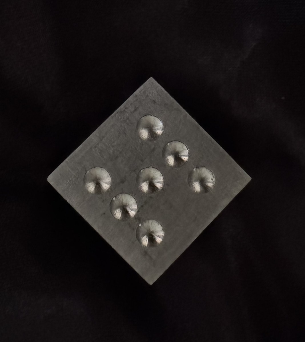 Machined aluminum die with seven pips